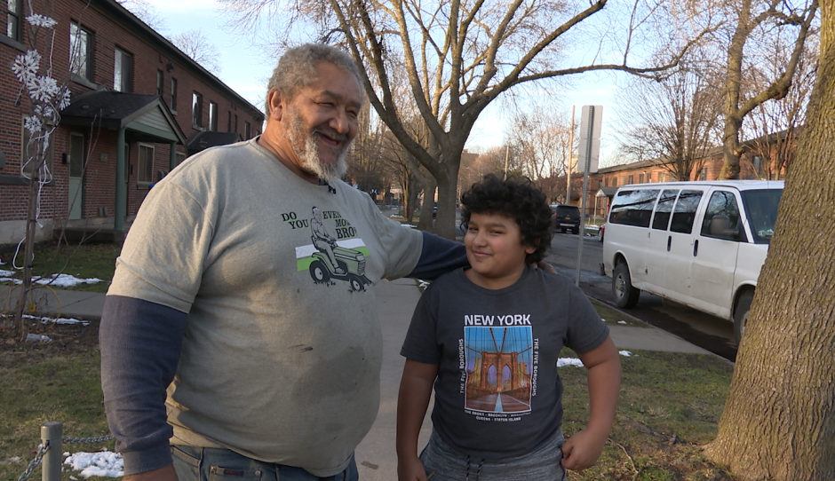 Gregory Myers and grandson outside of Pioneer Homes.